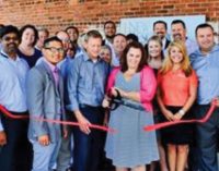 Ribbon cutting at new consulting firm’s office