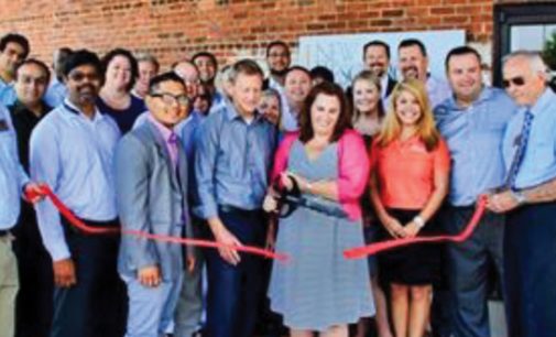 Ribbon cutting at new consulting firm’s office