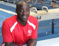 Former world-class gymnast Chris Young continues to pay it forward