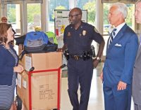 Police, lawyers deliver backpacks to schools