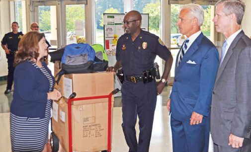 Police, lawyers deliver backpacks to schools