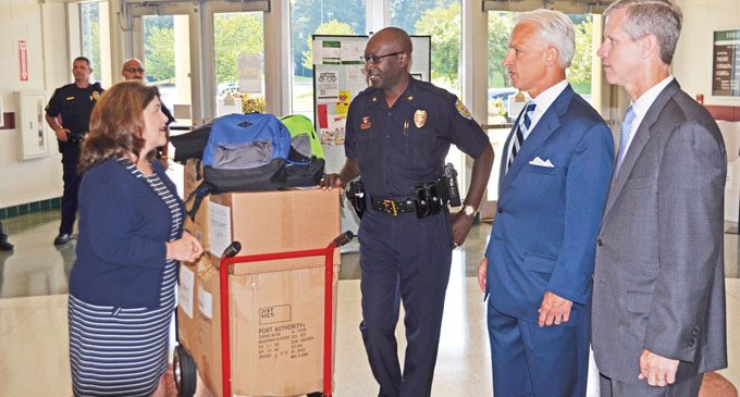 Police, lawyers deliver backpacks to schools