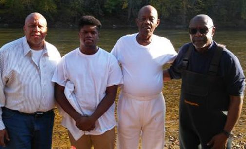 Church baptizes two in river