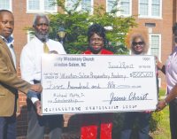 Church makes donation to Watts Scholarship Fund