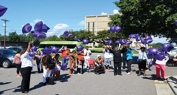 Balloon release marks Domestic Violence Awareness Month