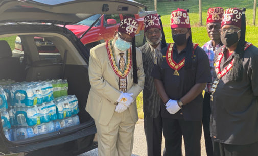 Shriners donate bottles of water to local homeless shelter