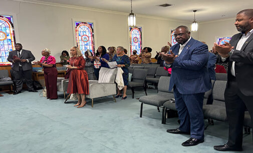 Members and officers of Cornerstone of Faith Ministries dedicate their new church