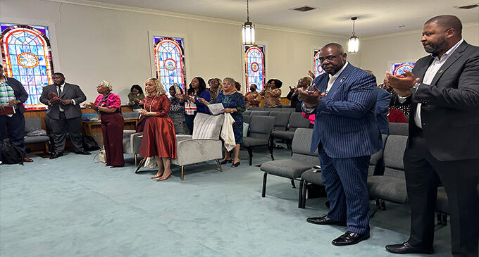 Members and officers of Cornerstone of Faith Ministries dedicate their new church