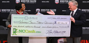 Winston-Salem State Chancellor Bonita Brown calls check from NCCash.com ‘Holiday Cheer’