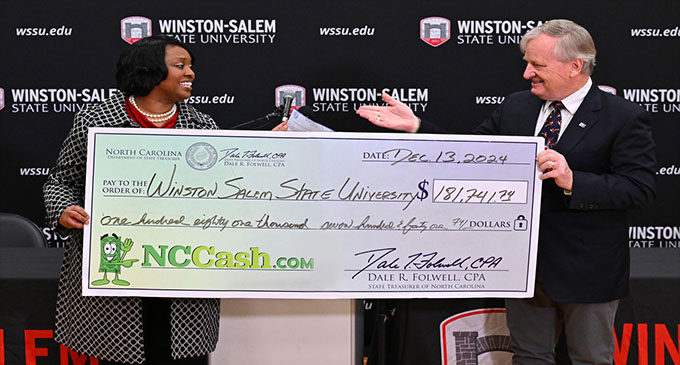 Winston-Salem State Chancellor Bonita Brown calls check from NCCash.com ‘Holiday Cheer’