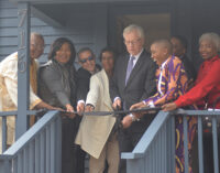 Ribbon cutting held for first restored shotgun house in Happy Hill